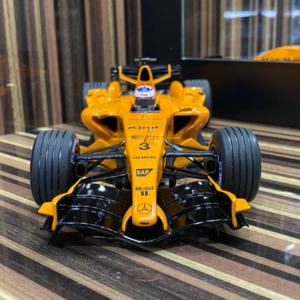 Minichamps McLaren Mercedes MP4-21 Kimi Raikkonen 2006 1:18 Diecast Model Orange - studio product photo of the scale model