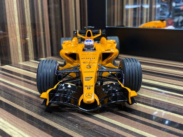 Minichamps McLaren Mercedes MP4-21 Kimi Raikkonen 2006 1:18 Diecast Model Orange - studio product photo of the scale model
