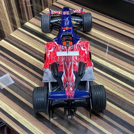 1/18 Toro Rosso Cosworth STR1 V. Liuzzi 2006 Formula 1 Blue/Red by Minichamps - studio product photo of the scale model