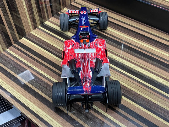 1/18 Toro Rosso Cosworth STR1 V. Liuzzi 2006 Formula 1 Blue/Red by Minichamps - studio product photo of the scale model