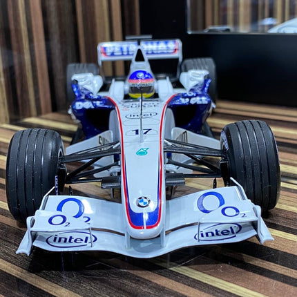Minichamps 1/18 BMW Sauber F1.06 J. Villeneuve 2006 White Diecast Model - studio product photo of the scale model