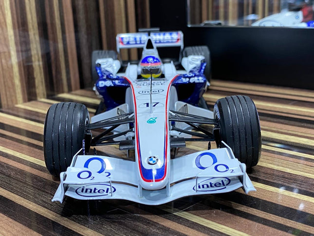 Minichamps 1/18 BMW Sauber F1.06 J. Villeneuve 2006 White Diecast Model - studio product photo of the scale model
