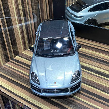Minichamps Porsche Cayenne 1:18 Silver Diecast Model Car - studio product photo of the scale model