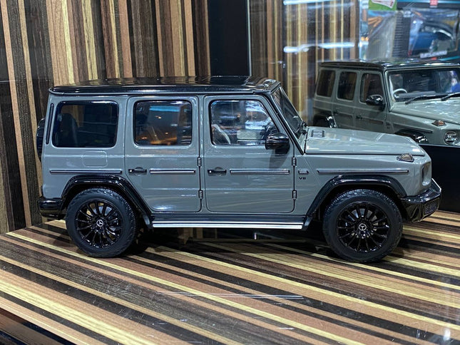 Minichamps 1/18 Mercedes-Benz G 63 AMG Line W463 Grey Diecast Model Car Dealer Edition - studio product photo of the scale mo