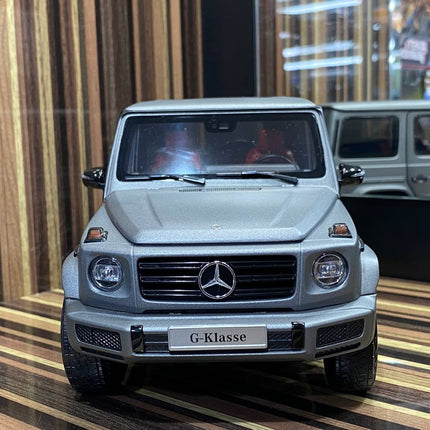 Minichamps 1:18 Mercedes Benz G63 Dealer Edition Diecast Model Matt Grey - studio product photo of the scale model