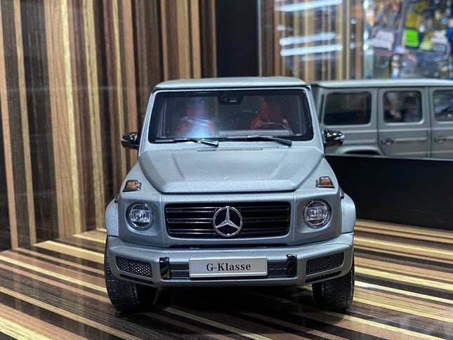 Minichamps 1:18 Mercedes Benz G63 Dealer Edition Diecast Model Matt Grey - studio product photo of the scale model