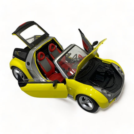 Bburago Smart Roadster Coupe 1/18 Diecast Model Car Yellow - detailed die-cast style model