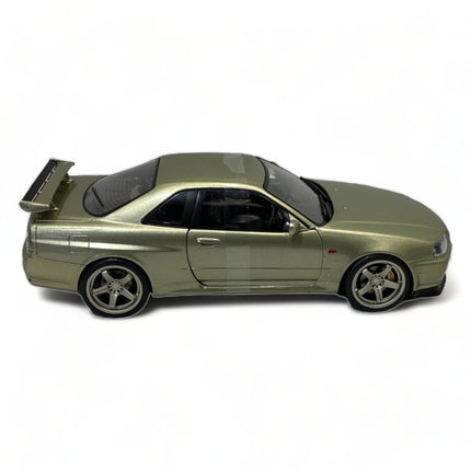 SOLIDO Nissan Skyline GT-R R34 1999 1:18 Diecast Model Car Green Metallic - studio product photo of the scale model