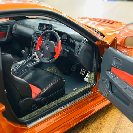 MotorHelix Nissan Skyline GT-R R34 Z-Tune Nismo 1/18 Diecast Model Metallic Orange - showroom-quality model replica
