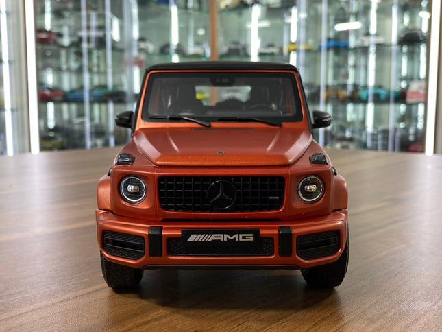 Minichamps Mercedes-Benz G 63 AMG 1/18 Diecast Model Copper Orange Magno - studio product photo of the scale model