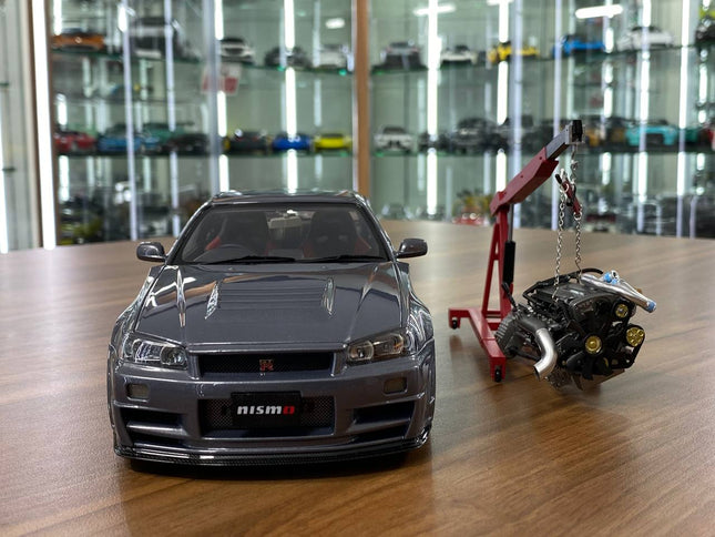 MotorHelix 1:18 Nissan Skyline GT-R R34 Nismo Z-Tune Gun Metallic Diecast Model - studio product photo of the scale model