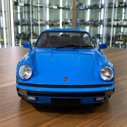Minichamps 1/12 Porsche 911 Turbo 1977 Mexico Blue Diecast Model - studio product photo of the scale model