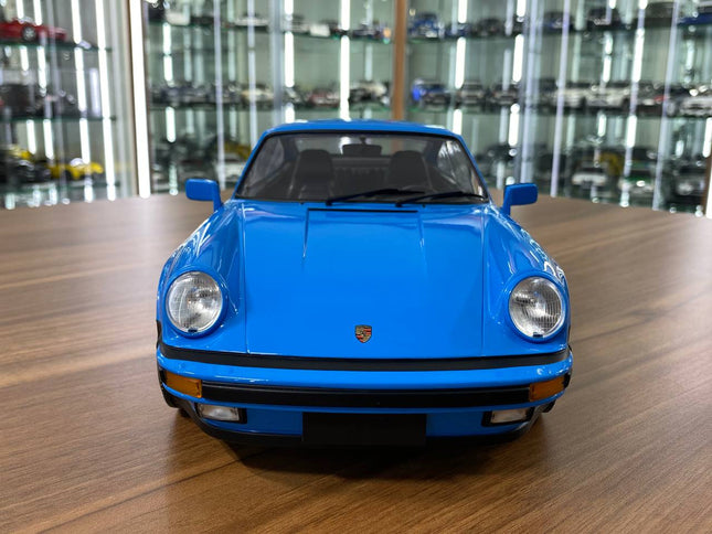 Minichamps 1/12 Porsche 911 Turbo 1977 Mexico Blue Diecast Model - studio product photo of the scale model