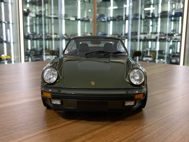 Minichamps Porsche 911 Turbo 1977 1/12 Diecast Model Olive - studio product photo of the scale model