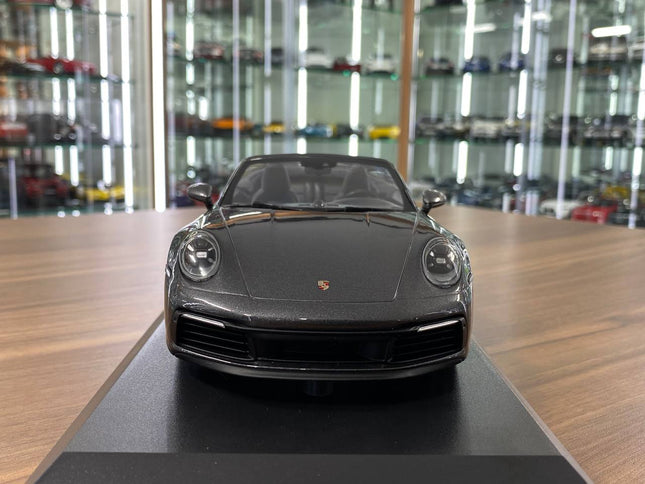 Minichamps 1/18 Porsche 911 Carrera 4S Cabriolet 2019 Grey Metallic - studio product photo of the scale model