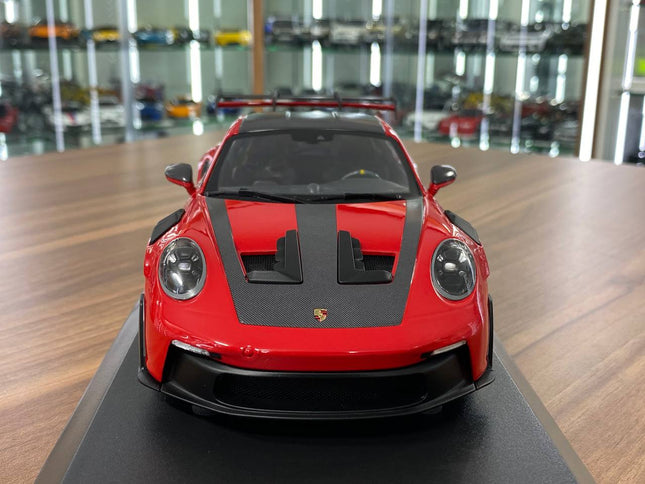 Minichamps Porsche 911 GT3 RS 2023 Weissach Paket 1:18 Diecast Red - studio product photo of the scale model