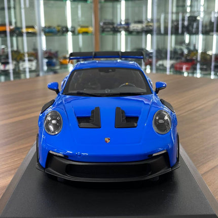 Minichamps Porsche 911 (992) GT3 RS 2023 1:18 Diecast Blue Silver Wheels - studio product photo of the scale model