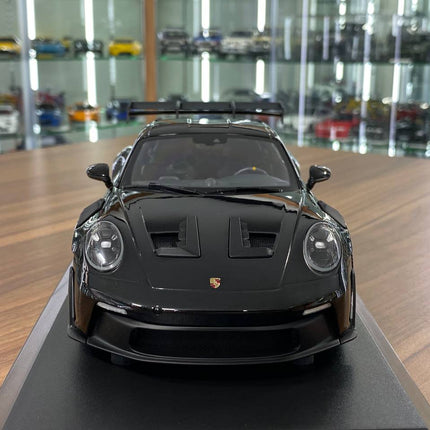 Minichamps 1:18 Porsche 911 (992) GT3 RS 2023 Black Diecast Model - studio product photo of the scale model