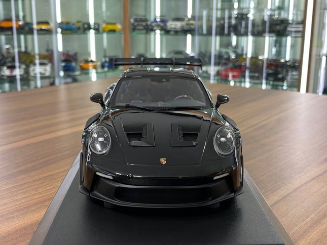 Minichamps 1:18 Porsche 911 (992) GT3 RS 2023 Black Diecast Model - studio product photo of the scale model