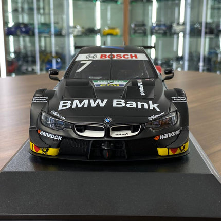 Minichamps 1:18 BMW M4 DTM 2019 #7 B. Spengler Matte Black Diecast Model - studio product photo of the scale model