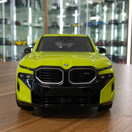 Minichamps 1/18 BMW XM 2023 Diecast Model Yellow - studio product photo of the scale model