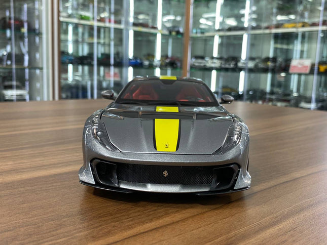 Bburago Signature Series Ferrari 812 Competizione 1:18 Diecast Model Car Grey Yellow Stripe - studio product photo of the sca