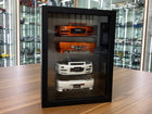 Motor Helix 1/18 Nissan Skyline R34 Bumper Display Frame Orange/Pearl White - detailed collector display model