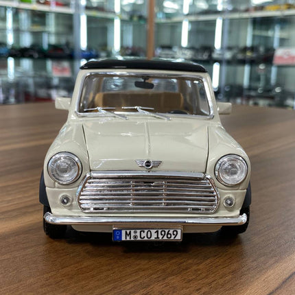 Bburago 1/18 1969 Mini Cooper Diecast Model Car Beige Black Top - studio product photo of the scale model