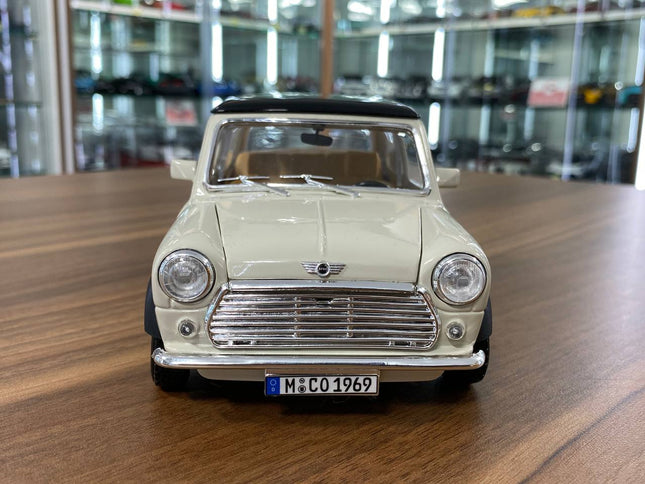 Bburago 1/18 1969 Mini Cooper Diecast Model Car Beige Black Top - studio product photo of the scale model