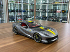 Bburago Signature Series Ferrari 812 Competizione 1:18 Diecast Model Car Grey Yellow Stripe - detailed collector display mode