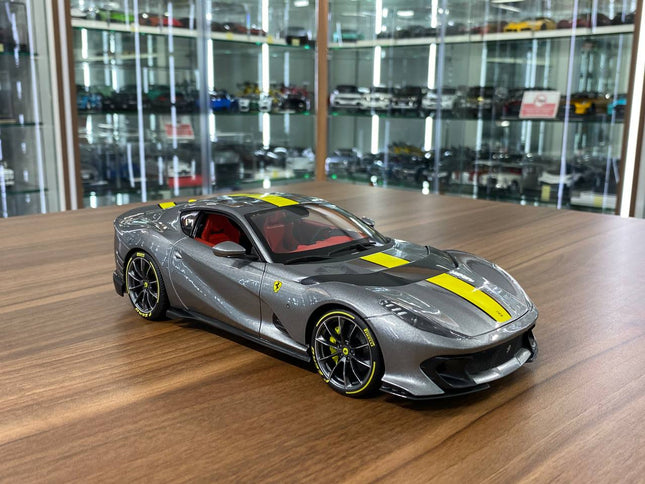 Bburago Signature Series Ferrari 812 Competizione 1:18 Diecast Model Car Grey Yellow Stripe - detailed collector display mode