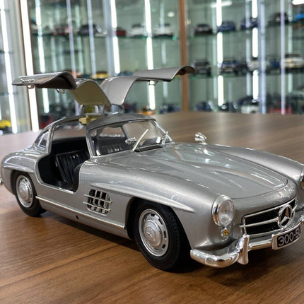 Minichamps Mercedes-Benz 300 SL 1955 1:18 Silver Diecast Model Car with Opening Doors - studio product photo of the scale mod