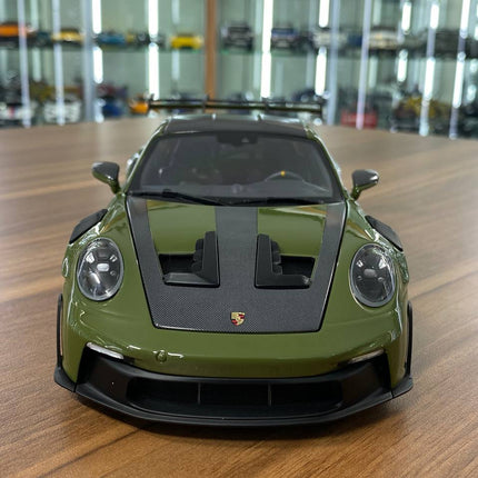 Minichamps Porsche 911 (992) GT3 RS 2024 Weissach Paket 1:18 Diecast Model NATO Olive - studio product photo of the scale mod