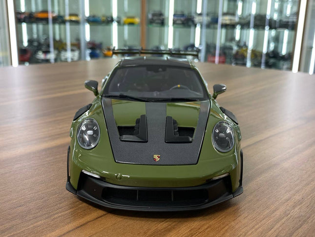 Minichamps Porsche 911 (992) GT3 RS 2024 Weissach Paket 1:18 Diecast Model NATO Olive - studio product photo of the scale mod