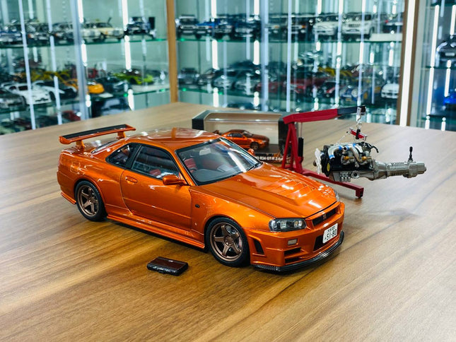 MotorHelix Nissan Skyline GT-R R34 Z-Tune Nismo 1/18 Diecast Model Metallic Orange - detailed collector display model