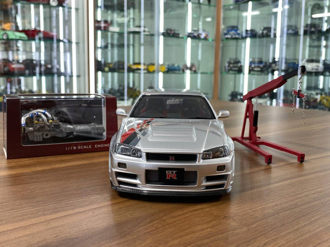 MotorHelix 1/18 Nissan Skyline GT-R R34 Nismo CRS Livery Silver Diecast Model - studio product photo of the scale model