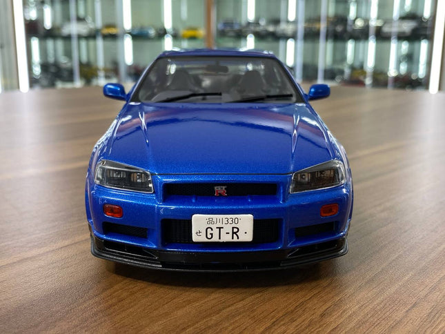 Solido 1/18 Nissan Skyline GT-R R34 Blue Diecast Model - studio product photo of the scale model