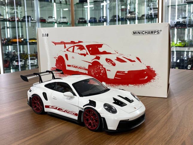 Minichamps Porsche 911 (992) GT3 RS 2022 Weissach Paket 1:18 Diecast Model Car White Red Wheels - studio product photo of the