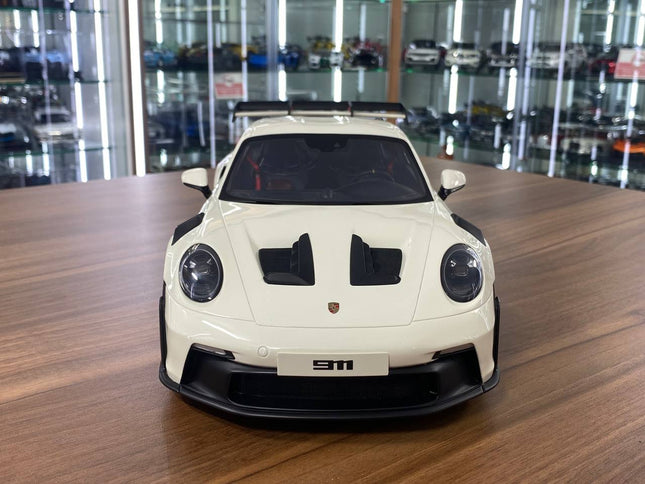 GT Spirit Porsche 911 (992) GT3 RS 1:12 Resin Model Car Off White Red Rim Limited Edition - studio product photo of the scale