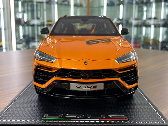 MR Collection Models Lamborghini Urus #63 1:18 Resin Model Orange Limited Edition - studio product photo of the scale model