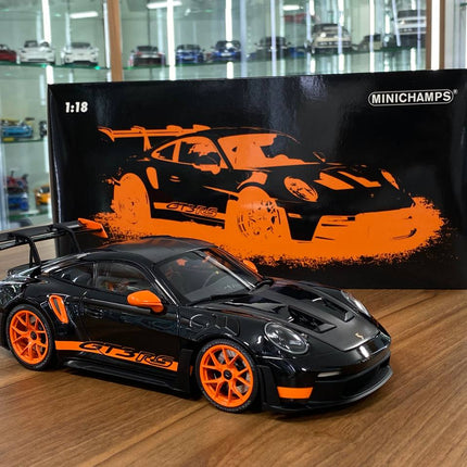 Minichamps Porsche 911 (992) GT3 RS Weissach Paket 1:18 Diecast Model Black - studio product photo of the scale model