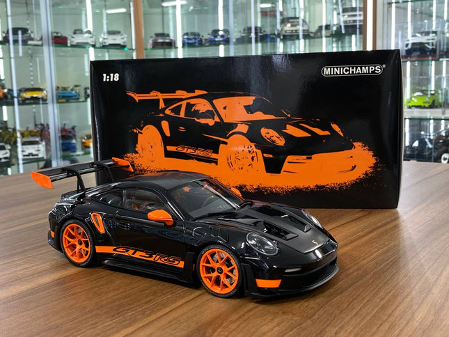 Minichamps Porsche 911 (992) GT3 RS Weissach Paket 1:18 Diecast Model Black - studio product photo of the scale model