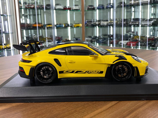 Minichamps Porsche 911 GT3 RS 2023 Weissach Paket 1:18 Diecast Model Yellow - studio product photo of the scale model