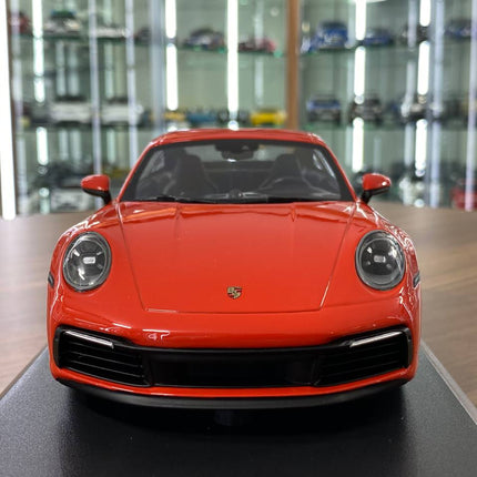Minichamps Porsche 911 Carrera 4S 2019 1:18 Resin Diecast Model Car Orange - studio product photo of the scale model