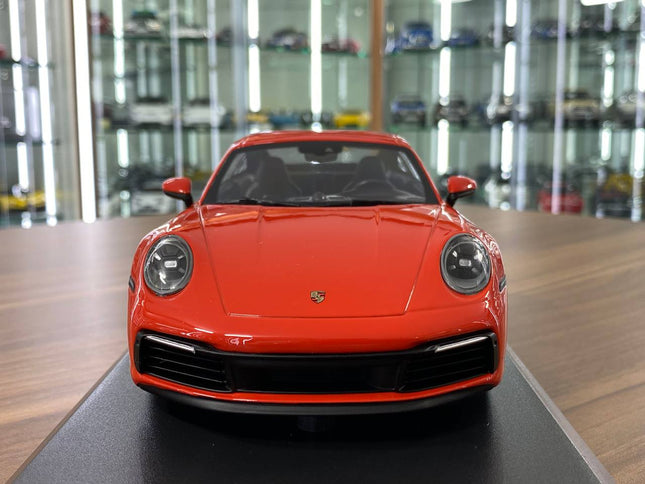 Minichamps Porsche 911 Carrera 4S 2019 1:18 Resin Diecast Model Car Orange - studio product photo of the scale model
