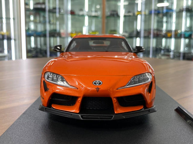 Solido Toyota Supra GR Tribute 2024 1:18 Orange Diecast Model Car - studio product photo of the scale model
