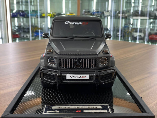 MotorHelix Mercedes-Benz G63 AMG W463 2021 1:18 Carbon Black Resin Model Car No Opening - studio product photo of the scale m