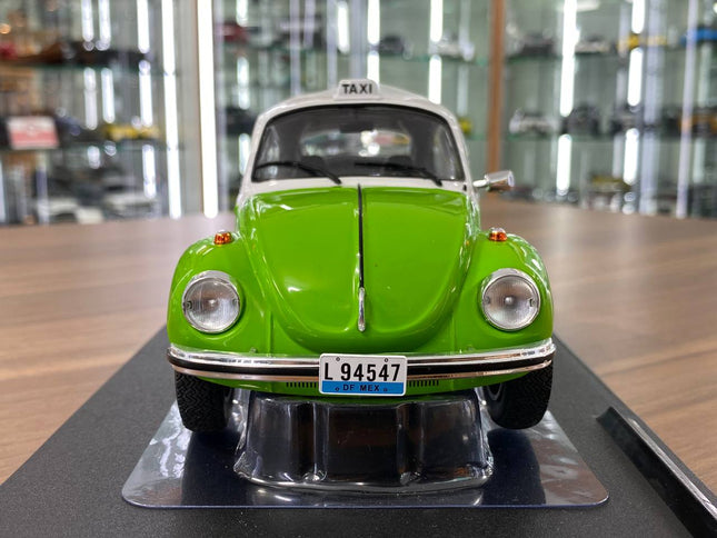 Solido Volkswagen Beetle 1303 Mexican Taxi 1974 1:18 Green Diecast Model - studio product photo of the scale model