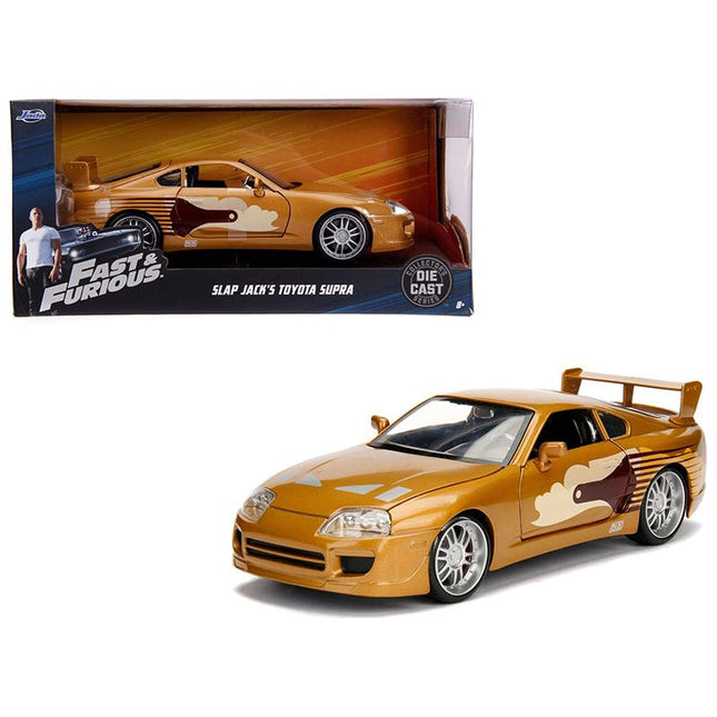 https://cdn.shopify.com/s/files/1/0504/9925/6496/files/slap-jacks-toyota-supra-gold-fast-furious-movie-124-diecast-model-car-by-jada-290081.jpg?v=1748419551