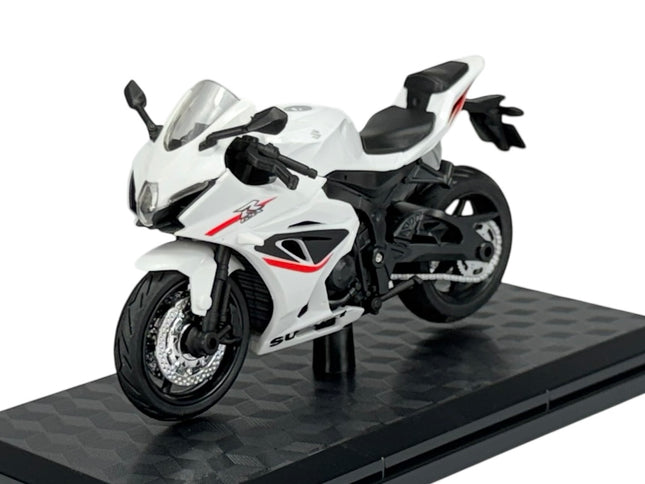 1:18 scale white Suzuki GSX-R1000 diecast model motorcycle with red accents on black stand